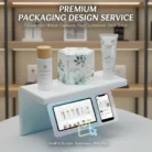 A display shows skincare products—bottle, box, and tube—branded “Aurora Glow” on a white stand. Below, a digital shelf displays product images on tablets. Text above reads: “Premium Packaging Design Service. Elevate Your Brand. Captivate Customers. Drive Sales.”.