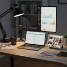 The Social Media Content Creation setup includes a laptop, upright monitor with graphs, tablet with photos, microphone, lamp, notebook and glasses, coffee mug, color swatches, plus shelves and décor for an inspiring workspace.
