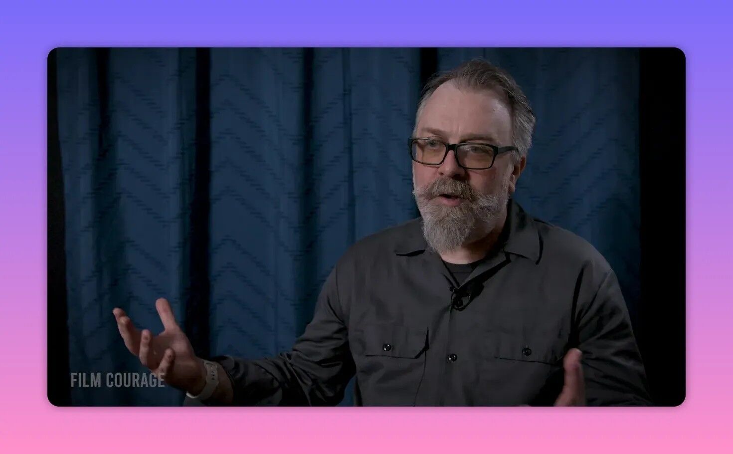 Interview subject with open hands, mid-shot, illustrating a point about journaling.